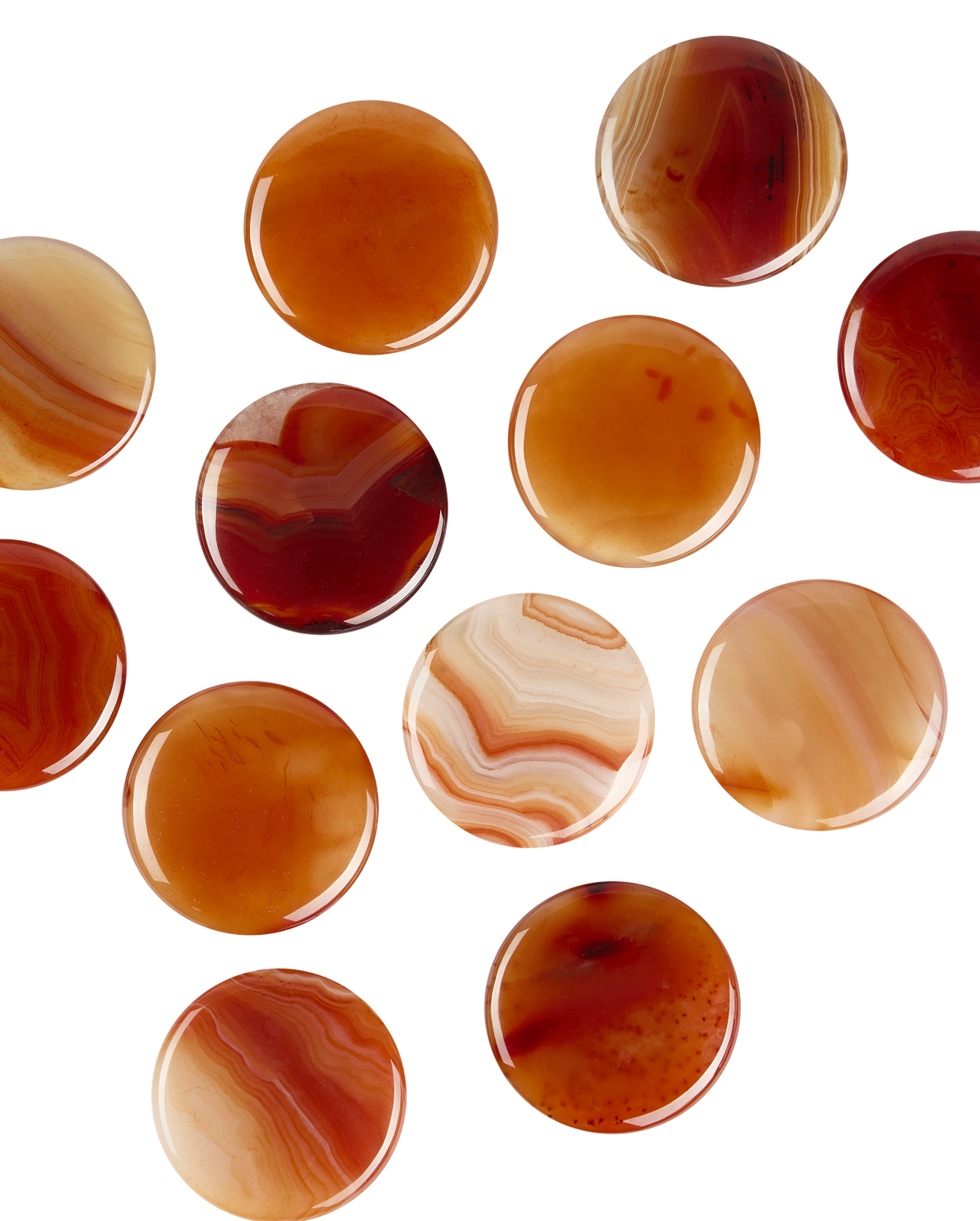 Polished carnelians, orange and red discs veined with white, like the one that comes with the Aura candle